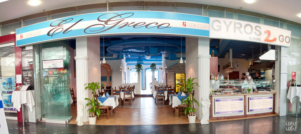 Eingang des El Greco im Gasometer mit Schriftzug und Gyros-2-Go-Theke